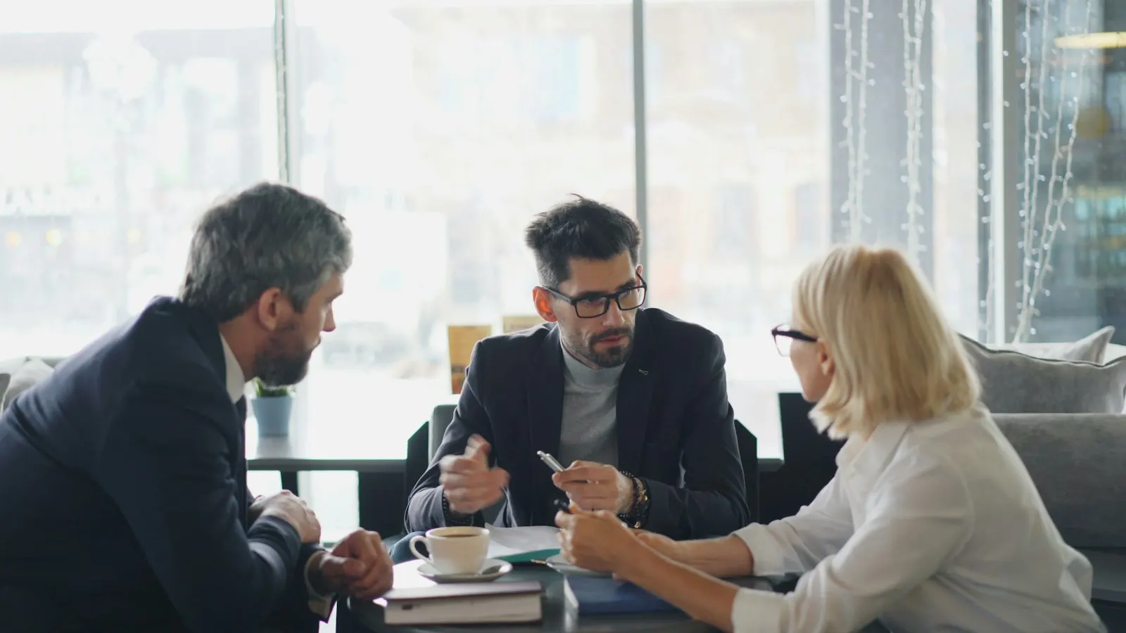 Business team talking around a table in an office